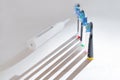 Electrical tooth brushes set in sunny day on white background Royalty Free Stock Photo