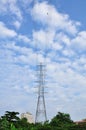 Electrical tower in field on blue sky Royalty Free Stock Photo
