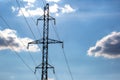 Electrical tower with voltage transmission wires against the background of blue sky. High voltage tower. power line support with Royalty Free Stock Photo