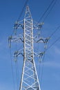 Electrical tower with voltage transmission wires against the background of blue sky. High voltage tower. power line support with Royalty Free Stock Photo