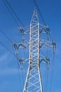 Electrical tower with voltage transmission wires against the background of blue sky. High voltage tower. power line support with Royalty Free Stock Photo