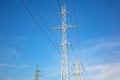 Electrical tower with voltage transmission wires against the background of blue sky. High voltage tower. power line support with Royalty Free Stock Photo