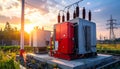 Electrical transformer substation with red and grey units during a golden sunset Keywords: electrical transformer Royalty Free Stock Photo