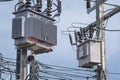 Electrical transformers on a power pole in Thailand, high voltage and power supply. Royalty Free Stock Photo