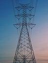 Electrical Transmission power line tower post pole against blue sky Royalty Free Stock Photo