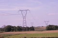 Electrical Transmission Towers Electricity Pylons at Sunset Royalty Free Stock Photo