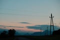 Electrical utility poles against a sunset Royalty Free Stock Photo