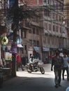 Electrical Wire Cable Tangled and Chaos at Thamel Street, Motorbike Rider Crossing, People Walking Wear Mask Royalty Free Stock Photo