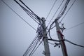 Electrical wires against sky. Wires on pole. Urban infrastructure Royalty Free Stock Photo