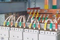 The electrical wires or cables are connected to the circuit breakers