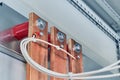 Electrical wires are connected to copper busbars.