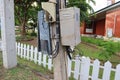 The electrical wiring control box is mounted on an outdoor pole.