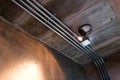 Electrical wiring work in a steel pipe of a house with a loft style design