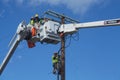 Electrical workers make repair on utility pole Royalty Free Stock Photo