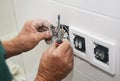 Electrican repair and installing socket, outlet plug