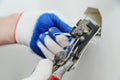 Electrican stripping insulation from wire. Royalty Free Stock Photo