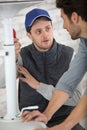 electrician with apprentice working in new home Royalty Free Stock Photo