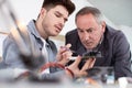 electrician with apprentice working in new home Royalty Free Stock Photo