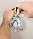 Electrician Attaching Ceiling Box Royalty Free Stock Photo