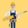 Electrician builder with a large screwdriver in his hands. Royalty Free Stock Photo