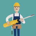 Electrician builder with a large screwdriver in his hands. Royalty Free Stock Photo