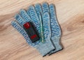 Hidden wiring detector, screwdriver tester and protective gloves out on the table Royalty Free Stock Photo