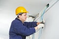 Electrician at cable wiring work Royalty Free Stock Photo