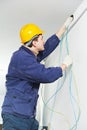 Electrician at cable wiring work Royalty Free Stock Photo