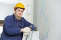 Electrician at cable wiring work Royalty Free Stock Photo