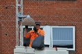 Electrician changeing street lamps in Kastrup danish capital