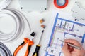 Electrician checking the electrical plans. Royalty Free Stock Photo