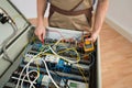 Electrician checking a fuse box Royalty Free Stock Photo