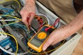 Electrician checking a fuse box Royalty Free Stock Photo