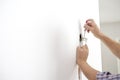 Electrician checking the presence of electrical current in a new Royalty Free Stock Photo