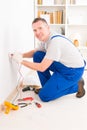 Electrician checking socket Royalty Free Stock Photo