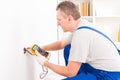 Electrician checking socket Royalty Free Stock Photo