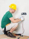 Electrician checking voltage