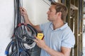 Electrician Fitting Wiring On Construction Site Royalty Free Stock Photo