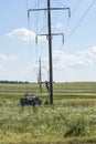 Electrician climbs on the pole for repair of electrical wiring