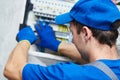 Electrician assembling power switchboard