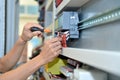 The electrician is connecting the electric cable wire Royalty Free Stock Photo