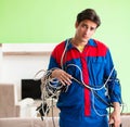 Electrician contractor with tangled cables Royalty Free Stock Photo