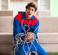 Electrician contractor with tangled cables