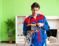 Electrician contractor with tangled cables Royalty Free Stock Photo