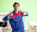 Electrician contractor with tangled cables Royalty Free Stock Photo