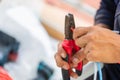 Electrician cuts electrical wires with pliers, Maintenance and repairing concepts Royalty Free Stock Photo