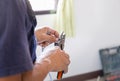 Electrician cuts electrical wires with pliers, Technician installing air conditioning in a client house, Repairman fixing air Royalty Free Stock Photo