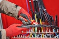 Electrician cutting cable isolation with knife