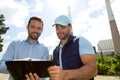 Electrician and engineer checking calendar at the electric station Royalty Free Stock Photo