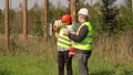 Electrician Engineer explains to worker assigned work